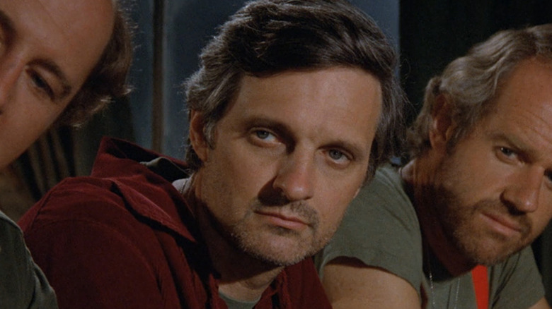 Alan Alda as Hawkeye Pierce frowning in M*A*S*H