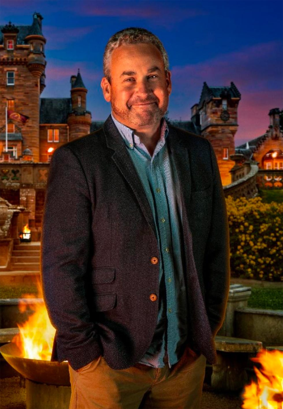 a person standing in front of a grand castle at dusk