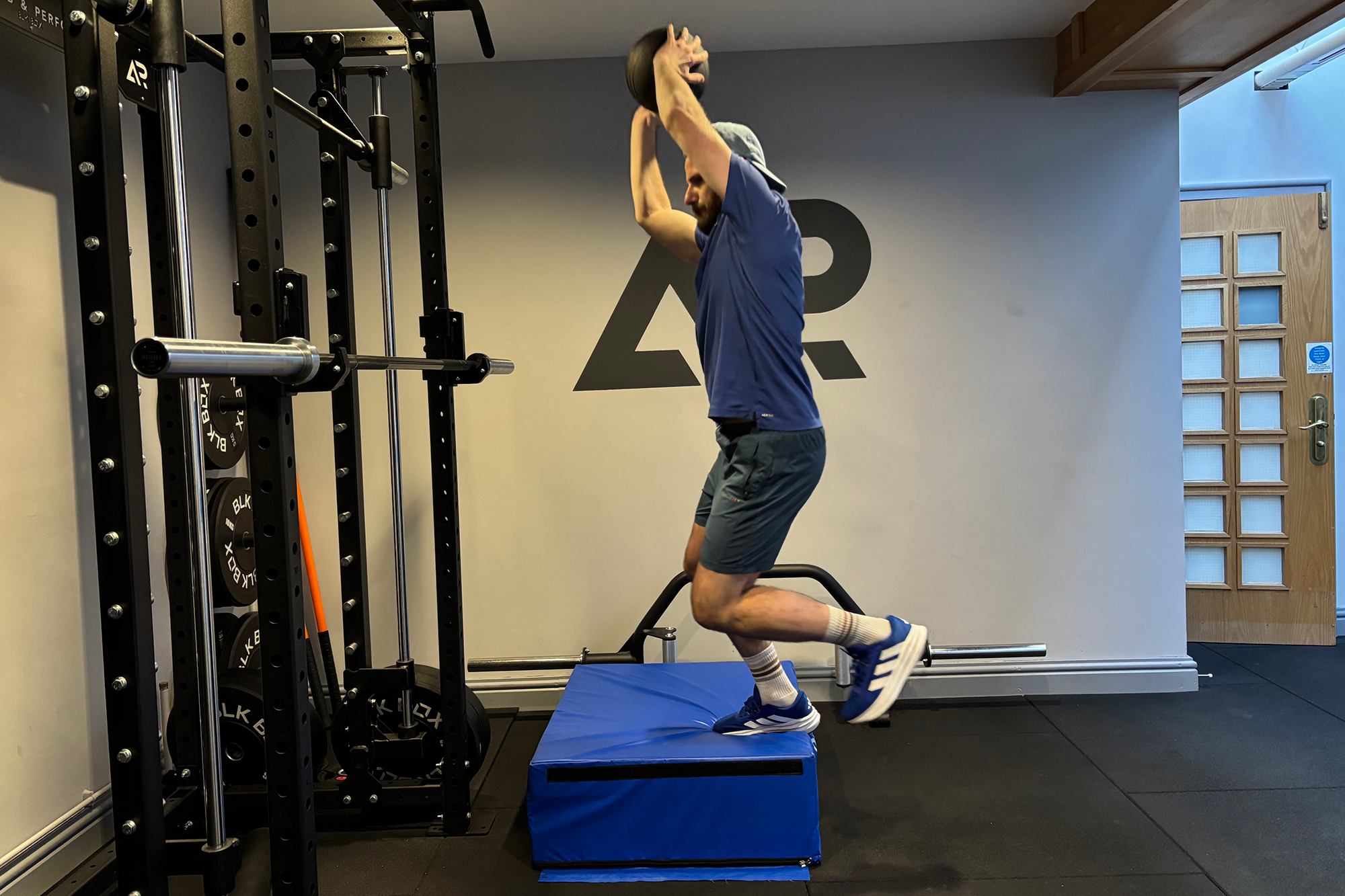 Baz Plummer demonstrating a lateral landing medicine ball weighted exercise to develop lower body stability and strength
