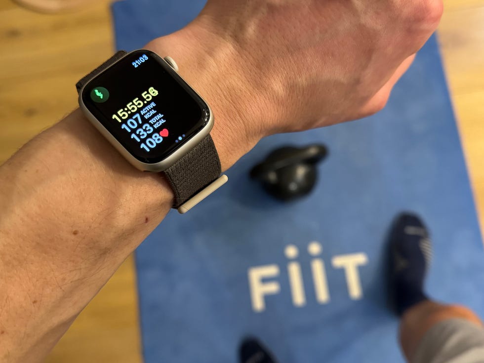 man checking watch after kettlebell workout