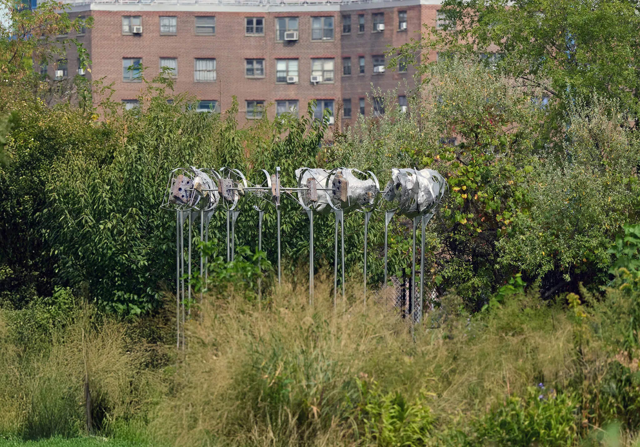 ‘Cradlers,’ 2025. Stainless steel, mild steel, fossiliferous limestone blocks, compressed post-consumer stainless steel, stainless steel hardware. (Photo: Argenis Apolinario)