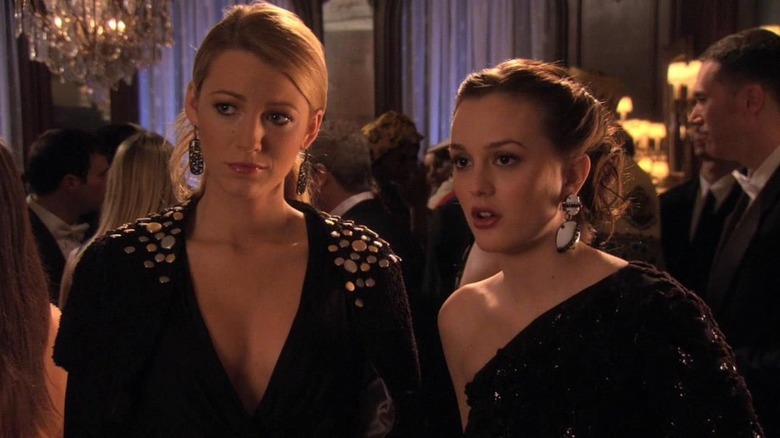 Blake Lively as Serena in black dress at party standing next to Leighton Meester as Blair in black dress in Gossip Girl
