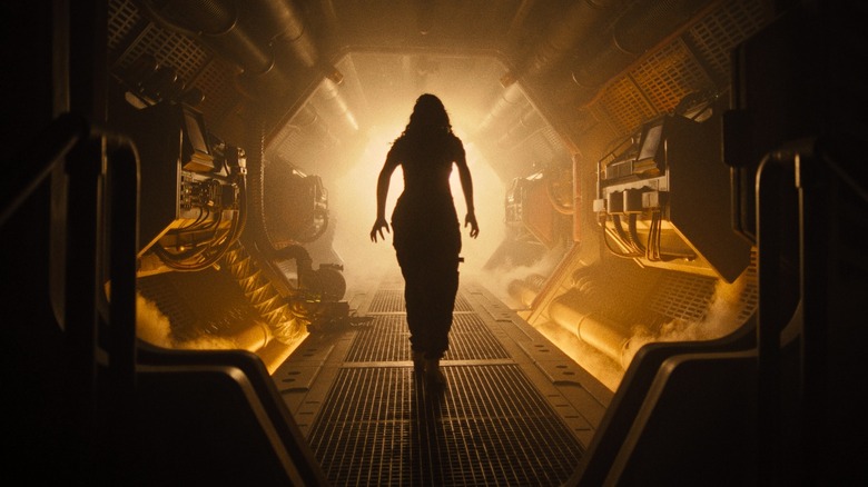 A shot of Isabela Merced's Kay walking through the ship in Alien: Romulus