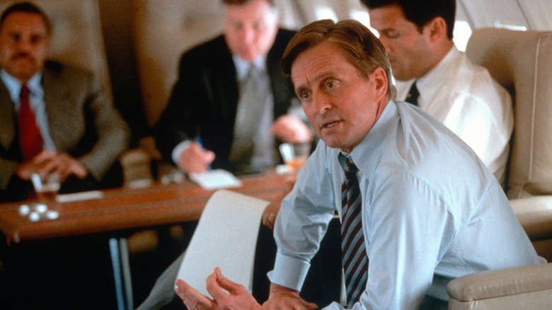 Michael Douglas as Robert Wakefield talking while aboard Air Force One in Traffic