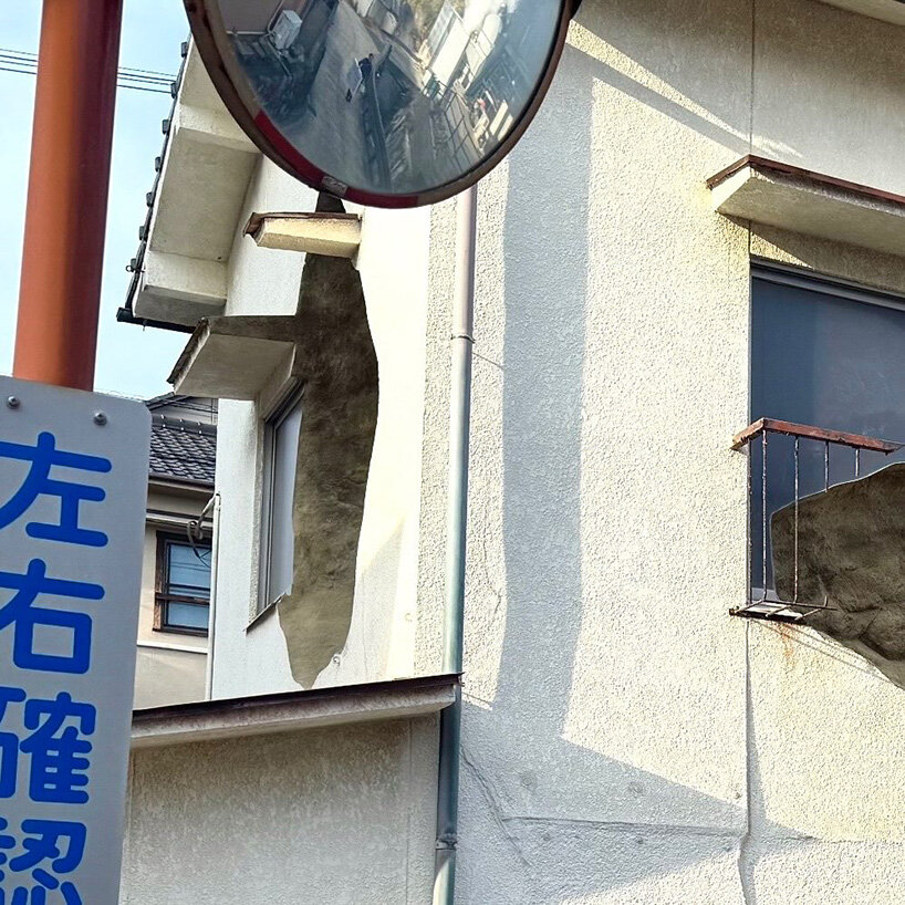 irregular voids carve cave-like, geological interior inside japanese residence