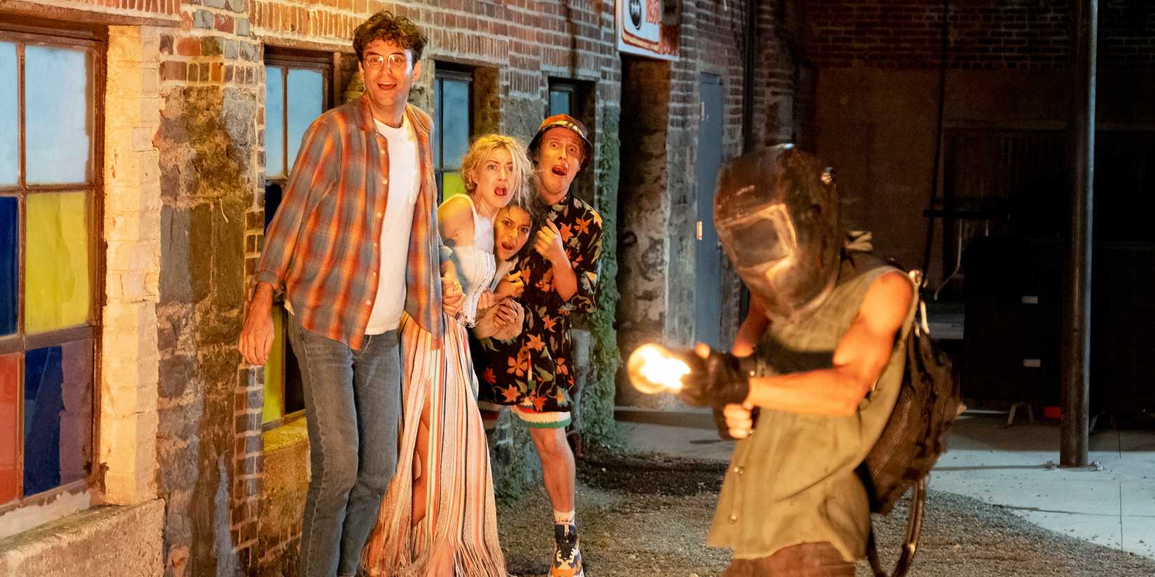 John Reynolds, Meredith Hagner, Alia Shawkat, and John Early screaming and hugging as Clare McNulty's Chantal shoots flames in Search Party Season 5