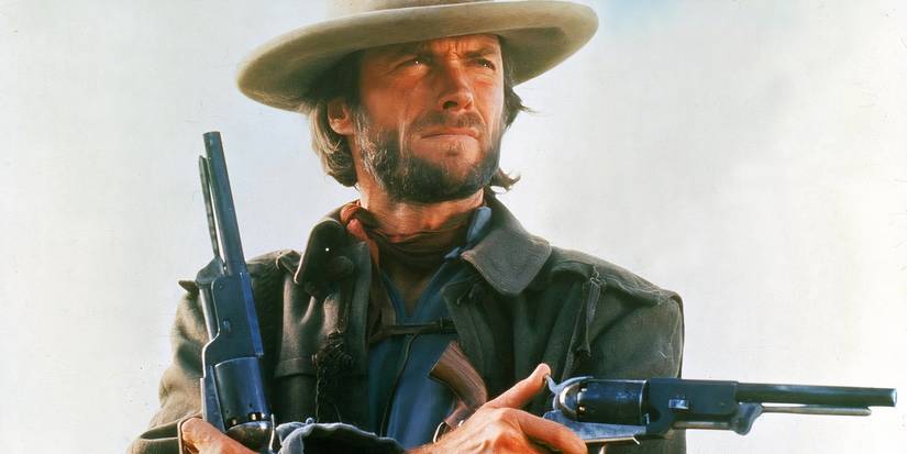 Clint Eastwood as Josey Wales, posing with his signature twin revolvers