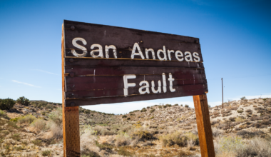 A sign posted where the San Andreas Fault intersects with Pallet Creek Road in Pearblossom California, a small town in Los Angeles County.