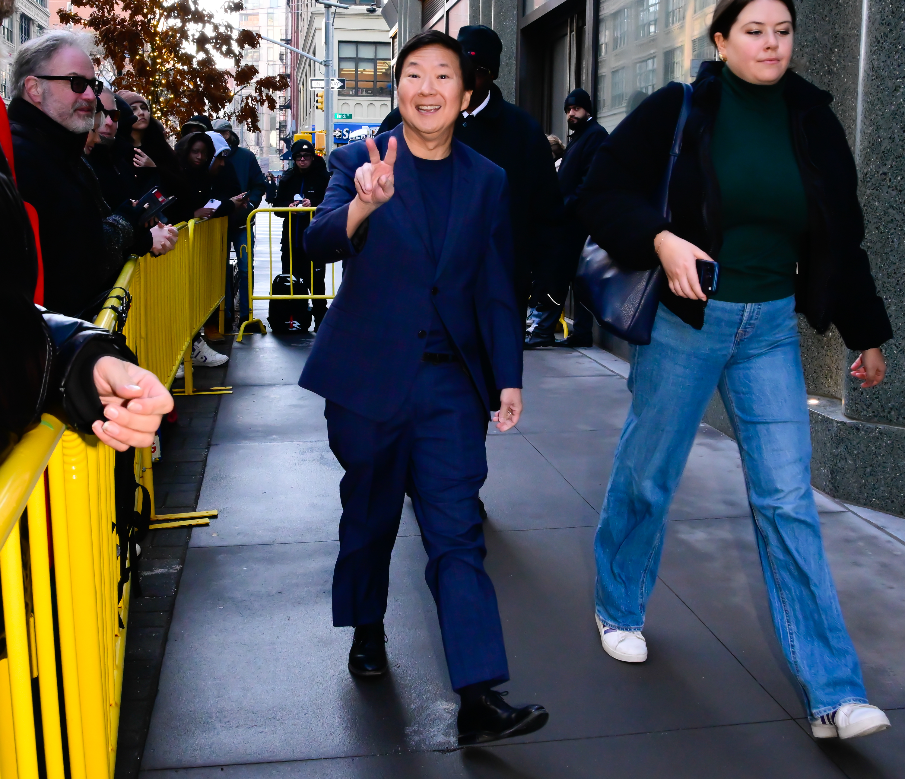 Ken Jeong flashes a peace sign while out in NYC.