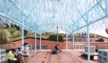 blue fabric fragments activate modular pavilion in colombia