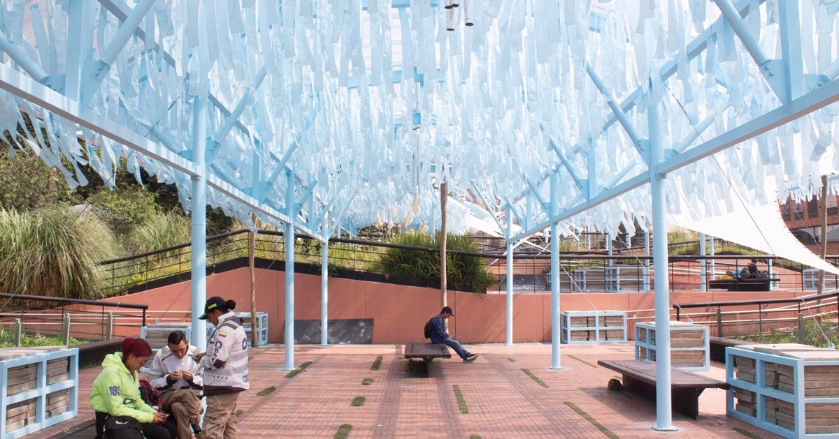 blue fabric fragments activate modular pavilion in colombia
