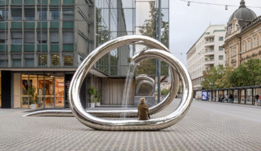 continuous steel loop forms water sculpture reflecting ljubljana’s urban fabric