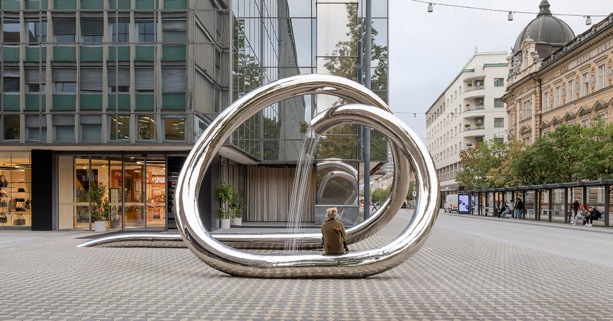 continuous steel loop forms water sculpture reflecting ljubljana’s urban fabric