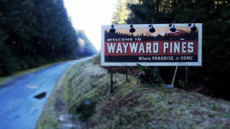 Wayward Pines sign at the city limits from the show's title card.