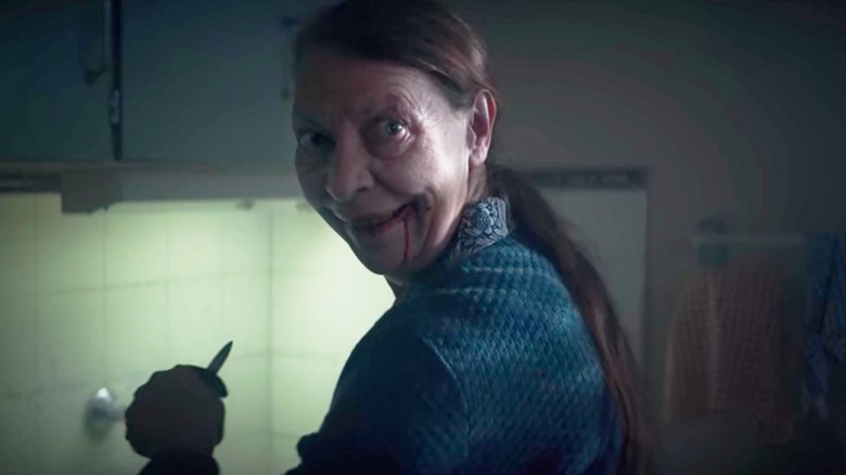 Mrs. Daugeron (Mireille Herbstmeyer) gives a creepy smile on Marianne