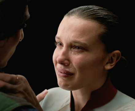 Millie Bobby Brown as Eleven crying while speaking to Mike in Stranger Things series finale