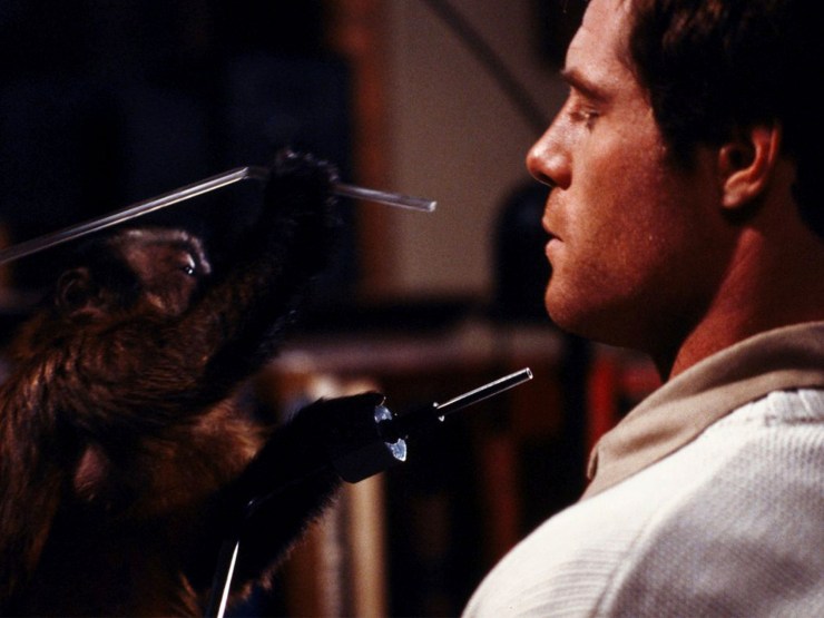 Ella holds blade up to Allan in Monkey Shines.