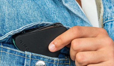 The NIMA Gluten Sensor being put in a denim jacket pocket.