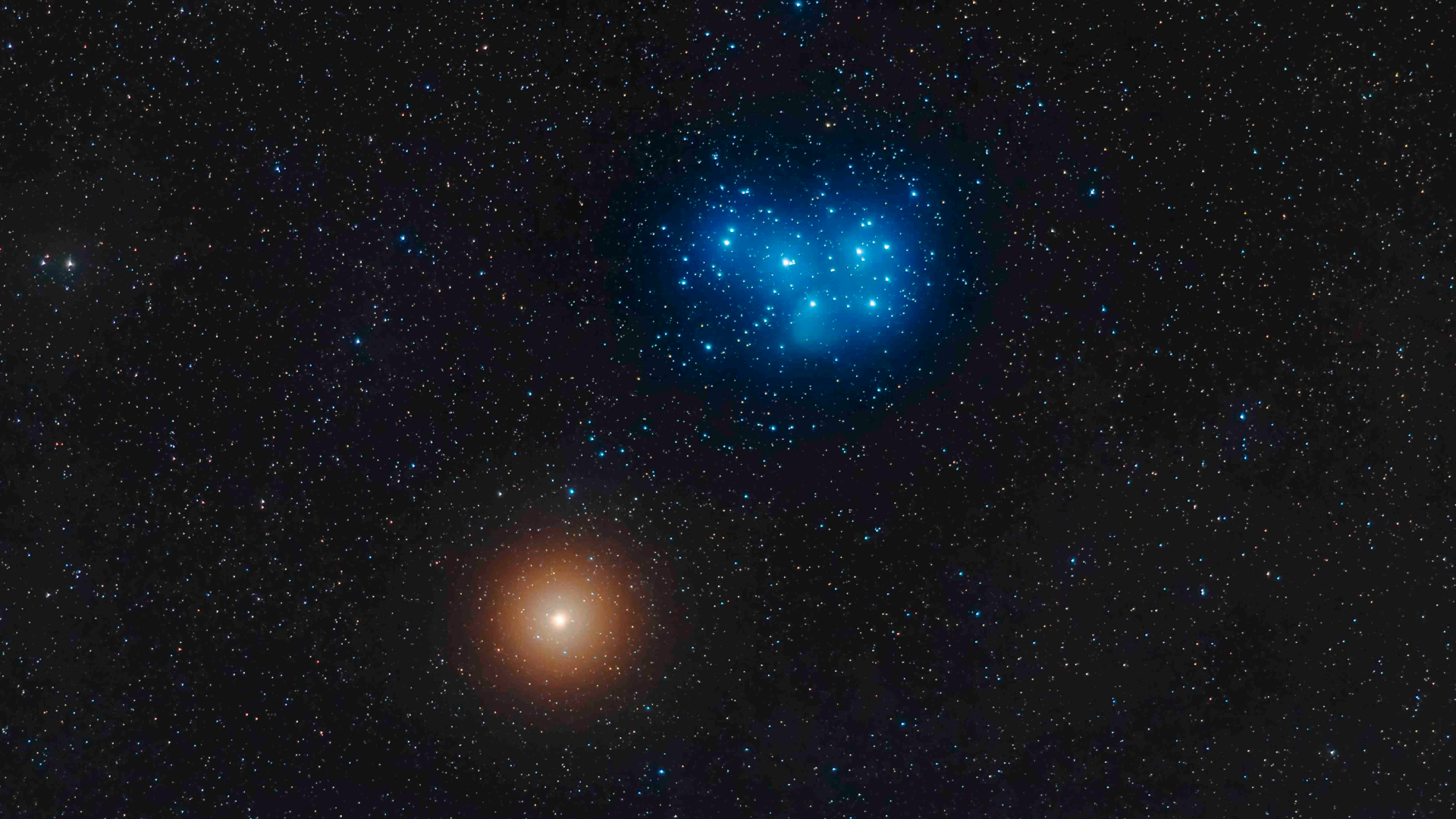 A photo of the night sky showing the blue-white stars of the Pleiades shining alongside the red light of Mars.
