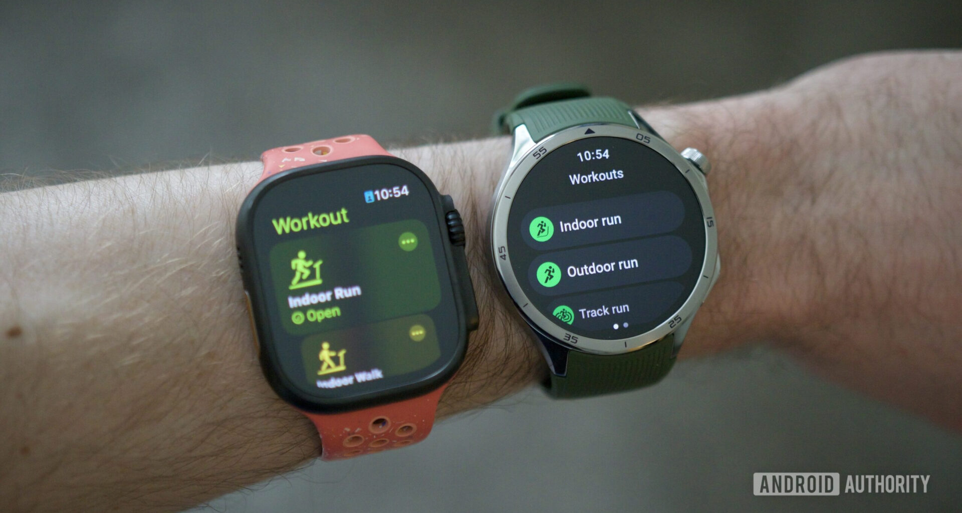 Someone wearing an Apple Watch Ultra 2 and OnePlus Watch 3.