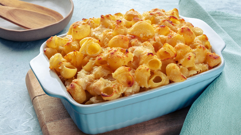 Mac and cheese macaroni pasta oven-baked in a casserole with cream.