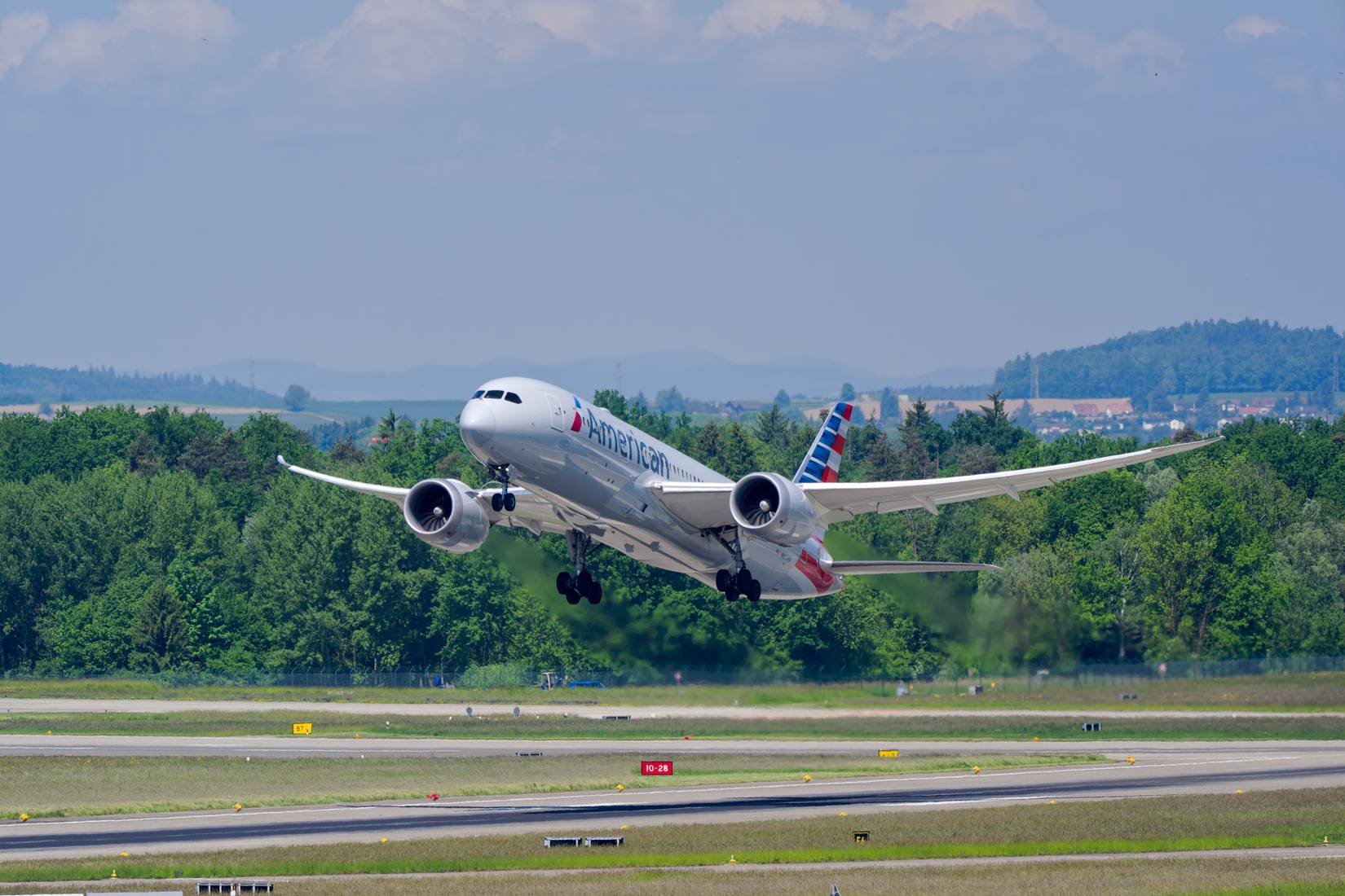 Passenger airplane American Airlines Boeing 787-8 Dreamliner N872AN taking off from Swiss Airport Zürich Kloten
