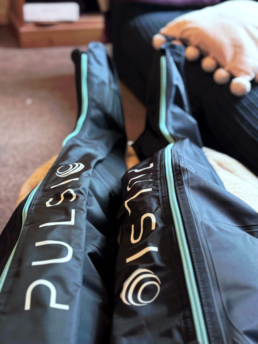 a pair of black compression boots