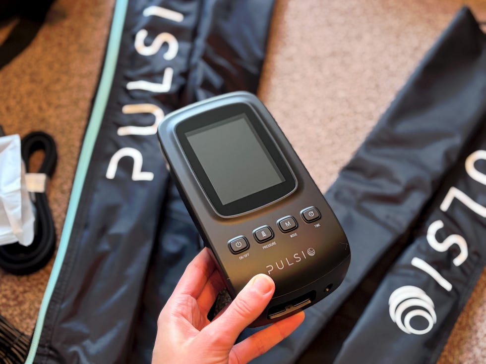 a handheld device for a compression therapy system alongside the therapy sleeves