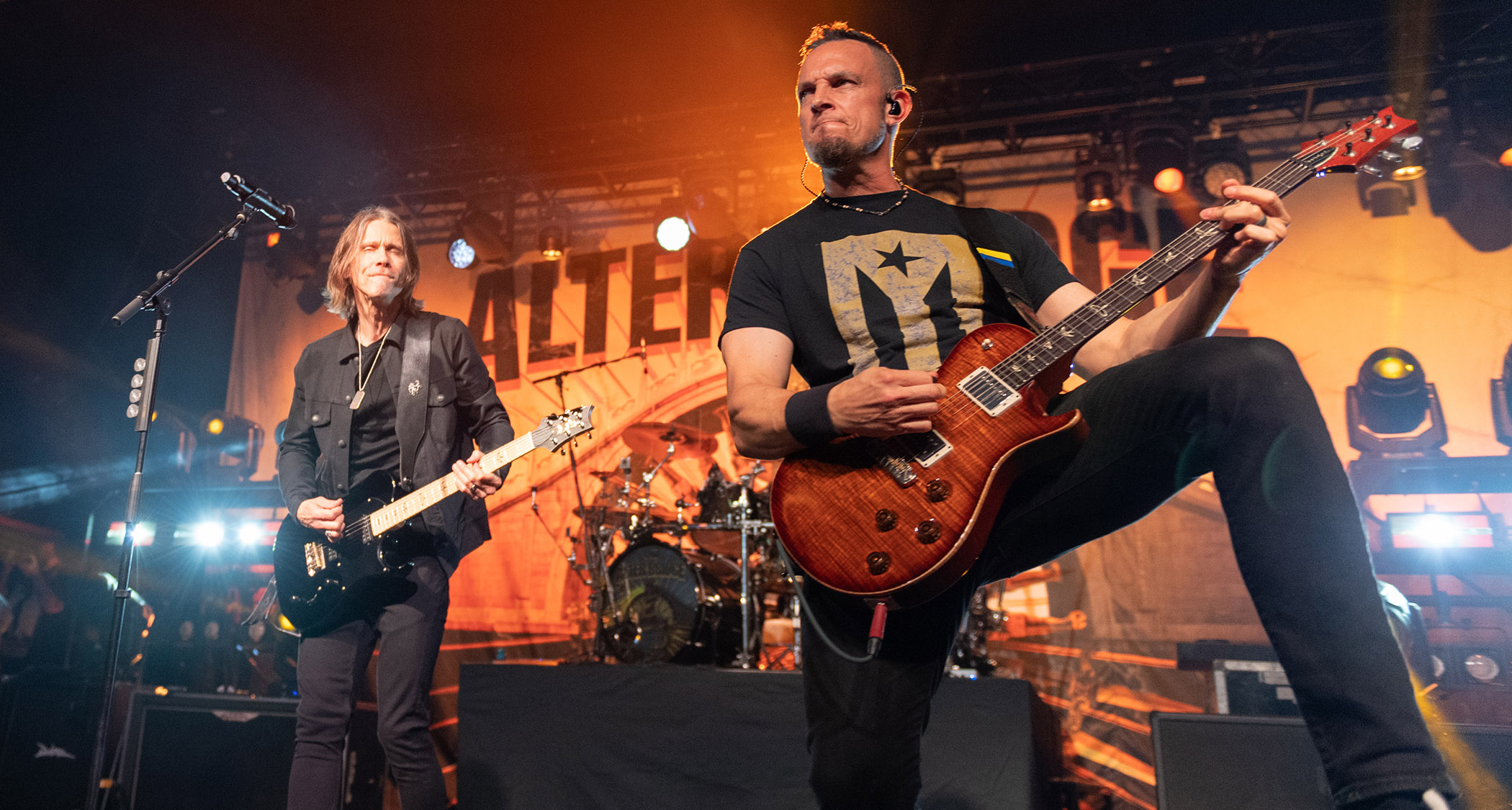 Myles Kennedy and Mark Tremonti perform live with Alter Bridge in 2023, both playing PRS electric guitars.