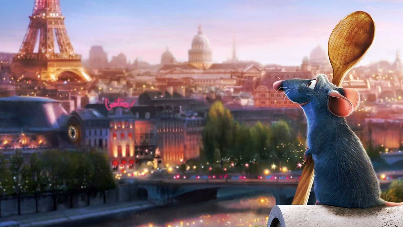 Remy holds a spoon while looking out over Paris in Ratatouille