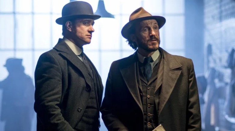 Edmund Reid (Matthew Macfadyen) and Bennet Drake (Jerome Flynn) with windows behind them in Ripper Street