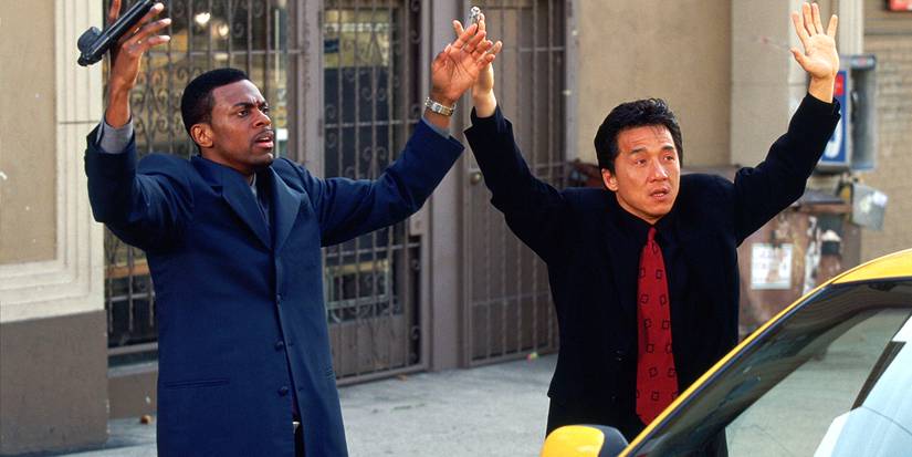 Chris Tucker and Jackie Chan with their hands up in 'Rush Hour'