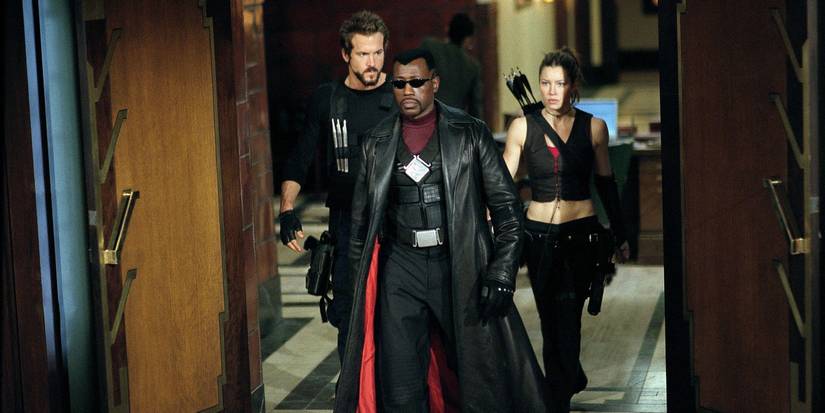 Ryan Reynolds, Jessica Biel, and Wesley Snipes as Hannibal King, Abigail Whistler, and Blade walking dramatically in Blade Trinity