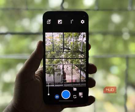Samsung Galaxy phone in hand showing Open Camera app