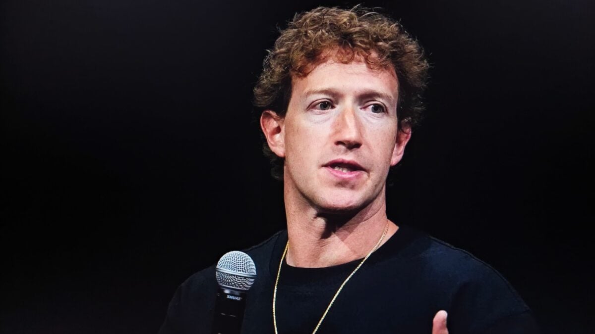 Mark Zuckerberg speaking to a microphone