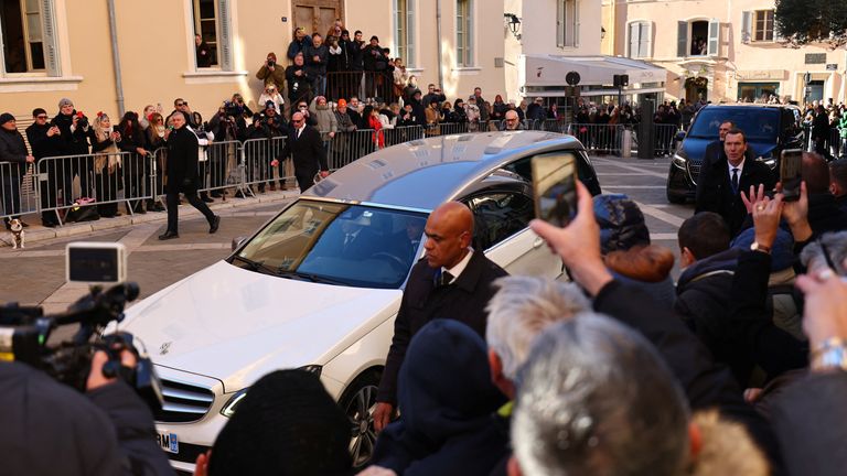 Crowds have gathered to see the late film star's coffin arrive. Pic: Reuters