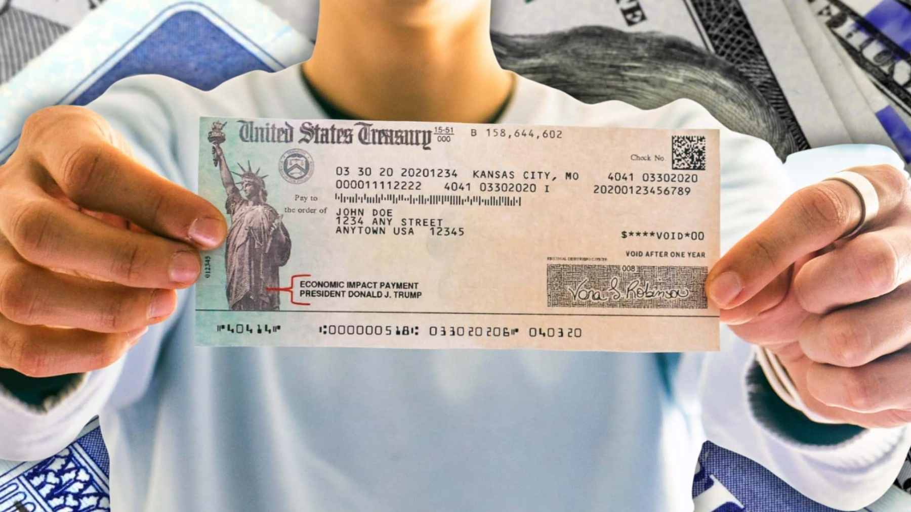 Person holding a U.S. Treasury Social Security check as new reports warn of a possible 23% automatic benefit cut