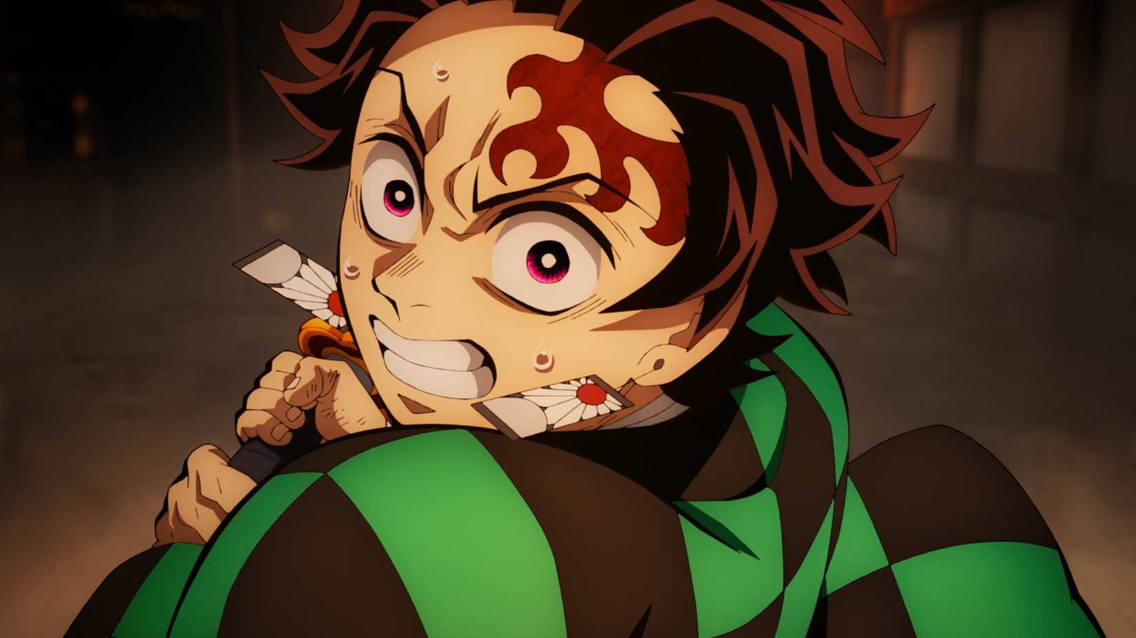 Tanjiro Kamado swinging his sword in a still from Demon Slayer Infinity Castle
