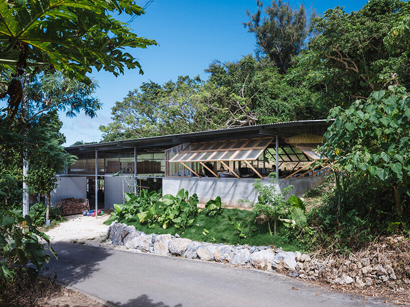 studio cochi architects wraps okinawa workspace in double-skin of insect netting and vinyl