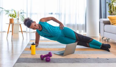 woman in side plank on a yoga mat at home