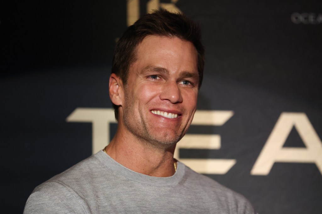 Tom Brady smiling at the Team Brady Leaders' Summit.
