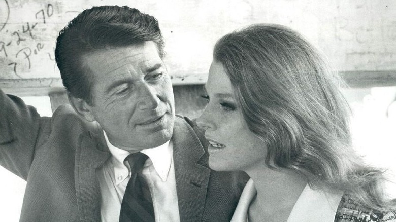 Inspector Lewis Erskine looks at a woman in The F.B.I.