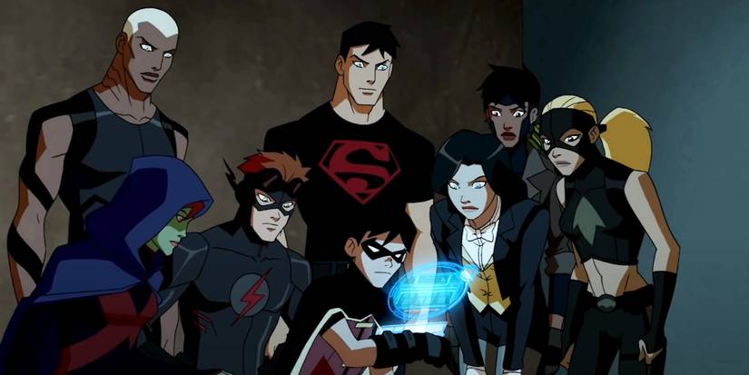 The hereos of Young Justice huddled together