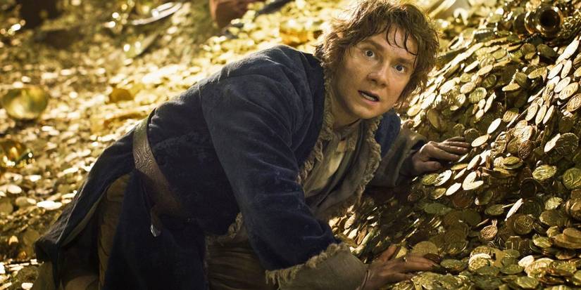 Bilbo lying on a mountain of gold in The Hobbit_ The Desolation of Smaug