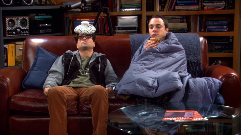 Leonard and Sheldon sick on the couch on The Big Bang Theory