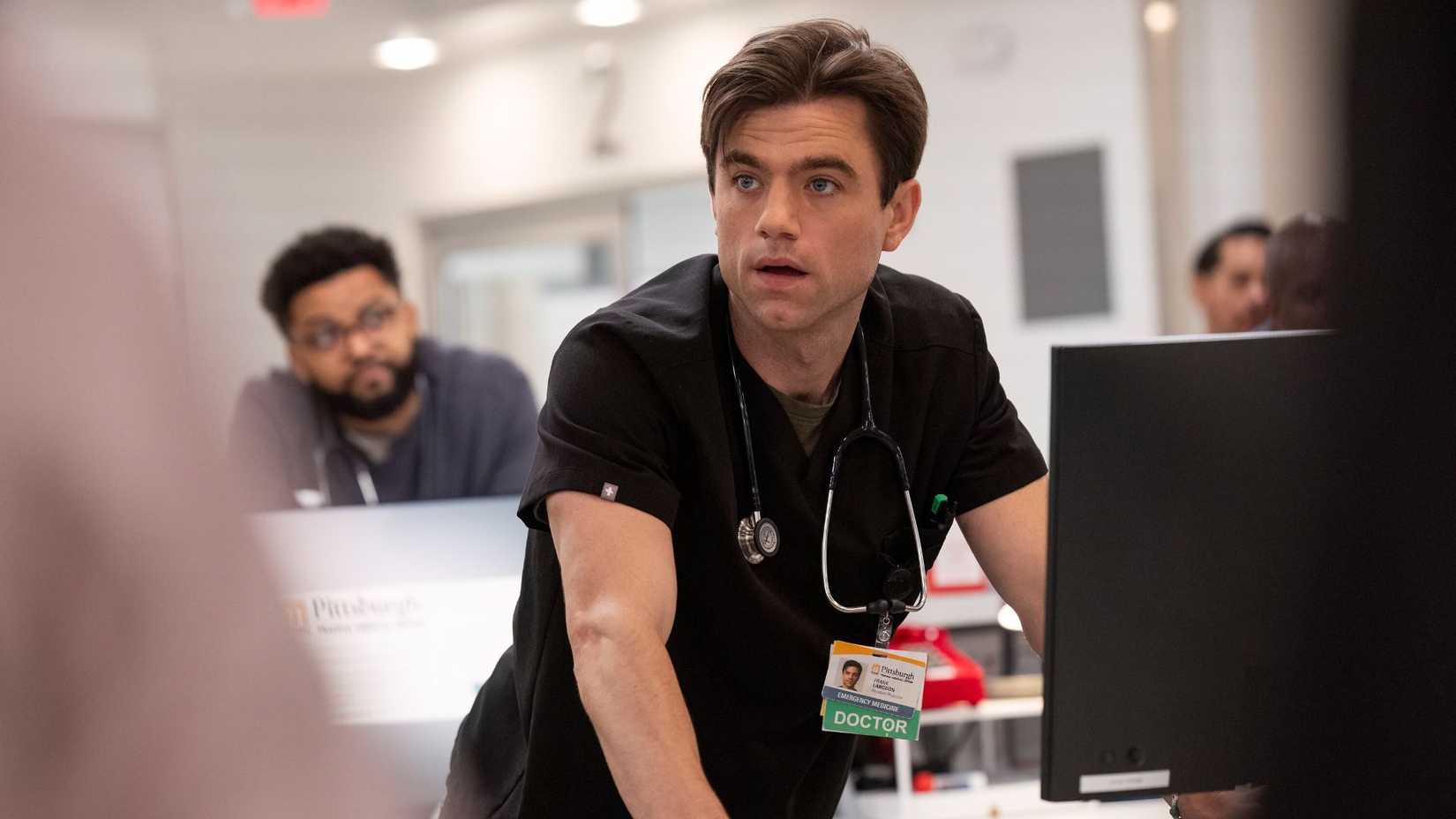 Patrick Ball as Dr. Frank Langdon looking surprised in The Pitt.