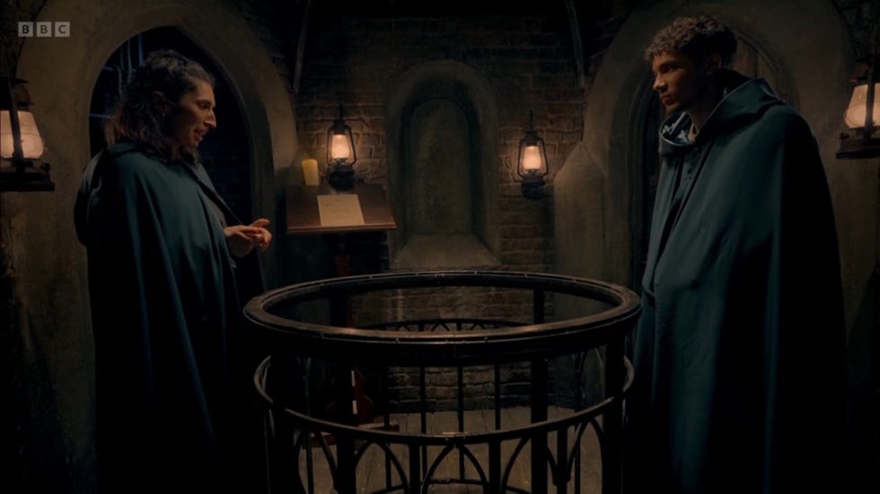 The Traitors UK season 3, Charlotte and Freddie the traitors uk season 3, charlotte and freddie in their traitors cloaks in the turret