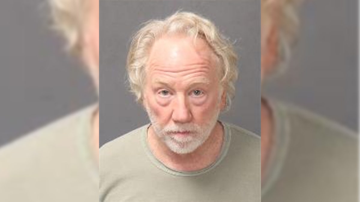 Actor Timothy Busfield solemn mug shot