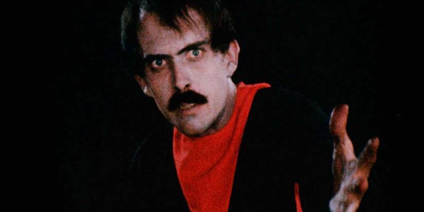 Tom Neyman as The Master pointing at something off camera in Manos: The Hands of Fate.