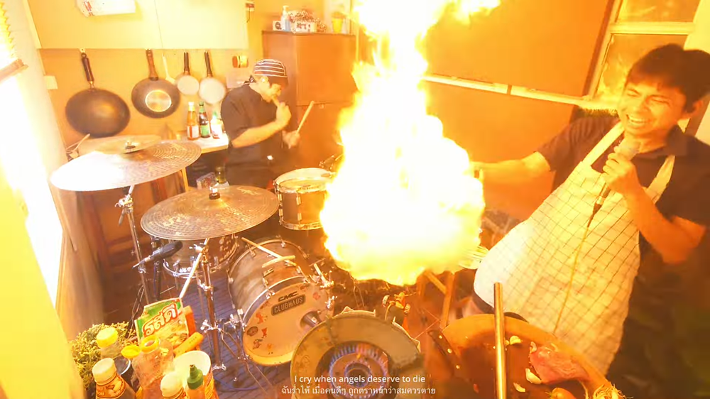 Watch Two Thai Dudes Almost Burn the Place Down Cooking and Covering "Chop Suey"